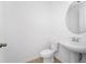 Clean bathroom with a pedestal sink and large mirror at 2362 Lancashire St, Davenport, FL 33896
