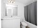 Clean bathroom with white cabinets and a shower/tub combo at 2362 Lancashire St, Davenport, FL 33896