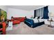 Spacious bedroom with a large bed and sectional sofa at 2362 Lancashire St, Davenport, FL 33896