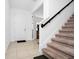 Staircase and tiled entryway leading into the home at 2362 Lancashire St, Davenport, FL 33896