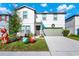 Two-story house with green garage door and festive holiday decor at 2362 Lancashire St, Davenport, FL 33896