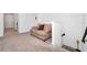 Upstairs hallway with a couch and carpeted flooring at 2362 Lancashire St, Davenport, FL 33896