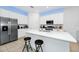 Modern kitchen with stainless steel appliances and an island at 2362 Lancashire St, Davenport, FL 33896