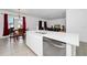 Modern kitchen island with white cabinets and stainless steel dishwasher at 2362 Lancashire St, Davenport, FL 33896