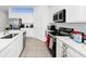 Modern kitchen with white cabinets and stainless steel appliances at 2362 Lancashire St, Davenport, FL 33896