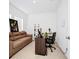 Home office with a desk, comfortable couch and natural light at 2362 Lancashire St, Davenport, FL 33896