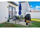 Private patio with seating area and grill at 2362 Lancashire St, Davenport, FL 33896