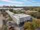 Aerial view of a condo building near the lake, showcasing ample parking and a waterfront location at 320 Lakeview St # 123, Orlando, FL 32804