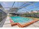 Community pool area with a screened enclosure, providing a refreshing and relaxing space at 320 Lakeview St # 123, Orlando, FL 32804