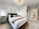Bright bedroom with a queen-size bed and stylish decor at 4190 Lana Ave, Davenport, FL 33897