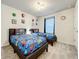Twin bedroom with superhero-themed bedding at 4190 Lana Ave, Davenport, FL 33897