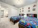 Twin bedroom with superhero-themed bedding at 4190 Lana Ave, Davenport, FL 33897