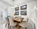 Bright dining room featuring a wood table and upholstered chairs at 4190 Lana Ave, Davenport, FL 33897