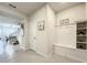Light and bright entryway with built-in bench seating and shelving at 4190 Lana Ave, Davenport, FL 33897