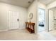 Home entryway with a mid-century modern console table and view of bedroom at 4190 Lana Ave, Davenport, FL 33897