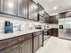 Modern kitchen with dark brown cabinets and granite countertops at 4190 Lana Ave, Davenport, FL 33897