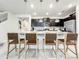 Modern kitchen with stainless steel appliances and an island with seating at 4190 Lana Ave, Davenport, FL 33897