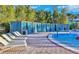 Luxury pool area with private cabanas and lounge chairs at 4190 Lana Ave, Davenport, FL 33897