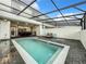Screened in pool area with patio furniture at 4190 Lana Ave, Davenport, FL 33897
