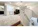 Upstairs landing with laundry and access to bedrooms and bathroom at 4190 Lana Ave, Davenport, FL 33897