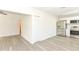 Kitchen and dining area with white walls and gray wood-look flooring at 550 N Ridgewood Ave, Daytona Beach, FL 32114