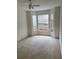 Bedroom with carpeted flooring and a bay window at 5542 Metrowest Blvd # 206, Orlando, FL 32811