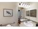 Bathroom with a single vanity, a large mirror, and grab bars for accessibility at 605 Rum Run # 605, Davenport, FL 33837