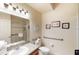 Accessible bathroom with a walk-in shower, grab bars, and a well-lit vanity at 605 Rum Run # 605, Davenport, FL 33837