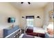 Twin bedroom featuring two twin beds, a dresser, a TV, and natural light from the window at 605 Rum Run # 605, Davenport, FL 33837