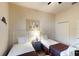 Cozy bedroom with two twin beds, a ceiling fan, and nautical-themed decor at 605 Rum Run # 605, Davenport, FL 33837