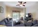 Inviting living area with comfortable seating, a TV, and access to a private balcony or patio at 605 Rum Run # 605, Davenport, FL 33837