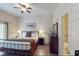 Relaxing main bedroom with a king-size bed, patio access, and ensuite bathroom at 605 Rum Run # 605, Davenport, FL 33837