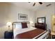 Large main bedroom featuring a king-size bed, nightstands, and an ensuite bathroom at 605 Rum Run # 605, Davenport, FL 33837