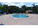 Community pool with individuals swimming at 605 Rum Run # 605, Davenport, FL 33837
