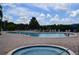 Community pool and hot tub with lounge chairs at 605 Rum Run # 605, Davenport, FL 33837