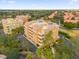 An aerial view showcasing a condo building's exterior and surrounding landscape at 7500 Toscana Blvd # 333, Orlando, FL 32819