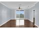 Bright bedroom with hardwood floors and sliding door to balcony at 7500 Toscana Blvd # 333, Orlando, FL 32819