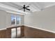 Spacious bedroom featuring hardwood floors and large windows at 7500 Toscana Blvd # 333, Orlando, FL 32819