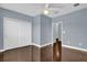 Bedroom with hardwood floors and double door closet at 7500 Toscana Blvd # 333, Orlando, FL 32819