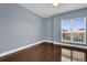 Bright bedroom with hardwood floors and window at 7500 Toscana Blvd # 333, Orlando, FL 32819