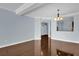 Bright dining room with hardwood floors and view to kitchen at 7500 Toscana Blvd # 333, Orlando, FL 32819