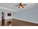 Spacious living room featuring hardwood floors and a ceiling fan at 7500 Toscana Blvd # 333, Orlando, FL 32819