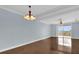 Living room with hardwood floors and balcony access at 7500 Toscana Blvd # 333, Orlando, FL 32819