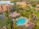 Community pool with surrounding patio furniture and landscaping at 7500 Toscana Blvd # 333, Orlando, FL 32819