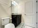 Small bathroom with toilet, sink, and shower at 826 Paradise Dr, Davenport, FL 33897