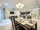 Open concept dining room with kitchen and living room views at 826 Paradise Dr, Davenport, FL 33897