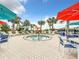 Relaxing hot tub surrounded by lounge chairs and umbrellas at 826 Paradise Dr, Davenport, FL 33897