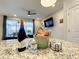 Kitchen island with wine, water, and snacks, overlooking Gathering room at 826 Paradise Dr, Davenport, FL 33897