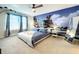 Main bedroom with beach mural and king-size bed at 826 Paradise Dr, Davenport, FL 33897