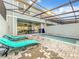 Private screened pool and patio with lounge chairs at 826 Paradise Dr, Davenport, FL 33897
